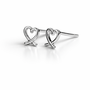 Silver heart-shaped earrings on a white background